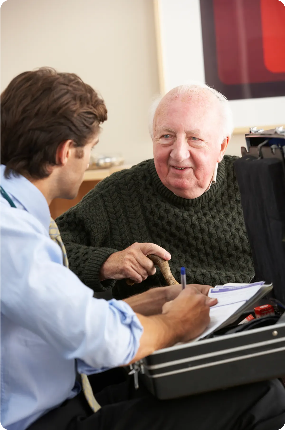 A Care Advisor discussing a care plan with an older man