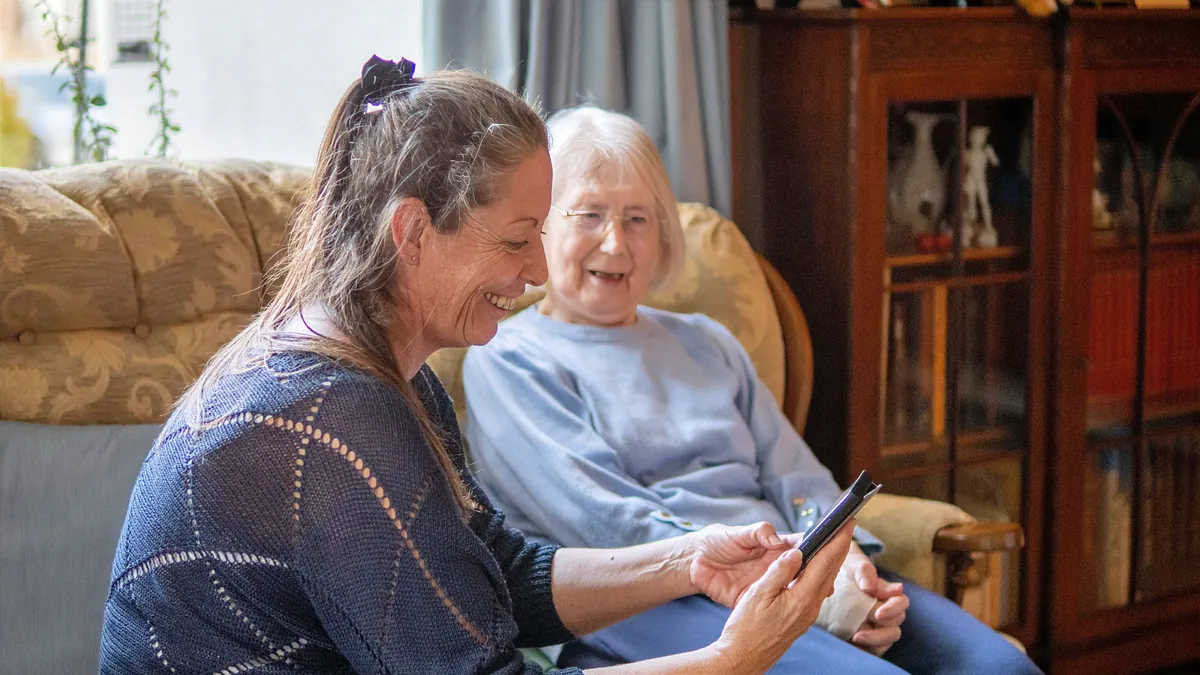 An Edyn carer spending time with an older woman in her home